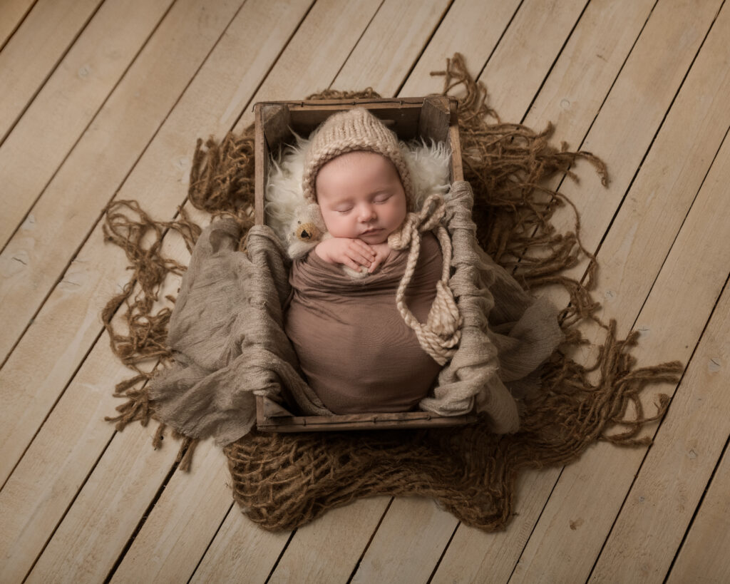 Newborn in a crate